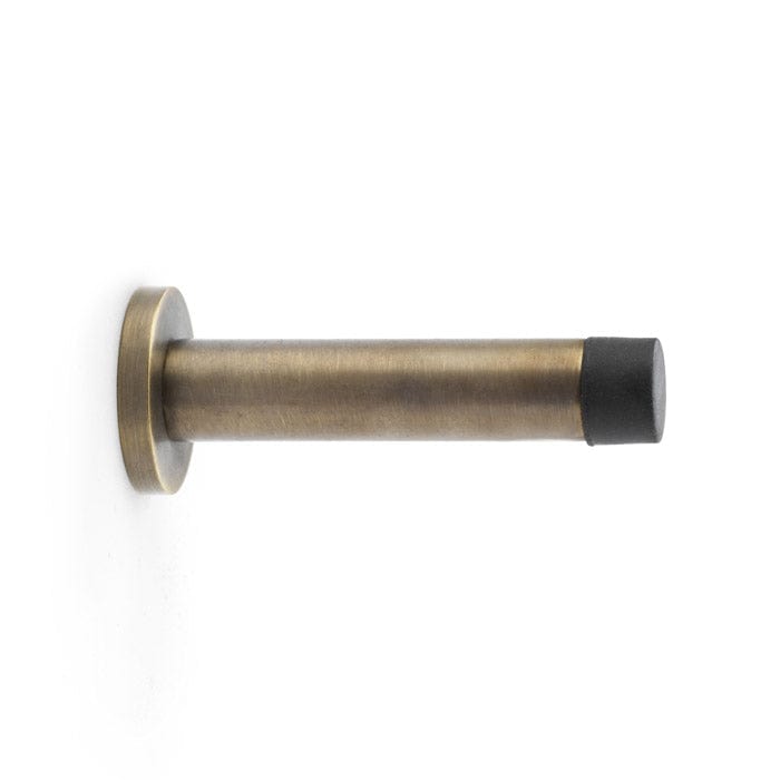 Base Wall | Dørstopper i Antik Messing Ø 16 mm x D 90 mm Alexander & Wilks AW616AB FINICC